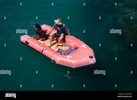 Inflatable Safety Boat Waits In Calm Water Stock Photo Alamy