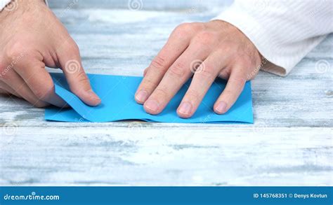 Close Up Hands Folding Blue Paper Sheet Stock Image Image Of Male