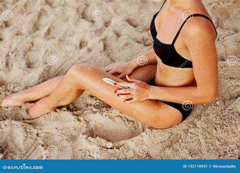 Suncream Suntan Lotion Woman Applying On Beautiful Legs Sunscreen