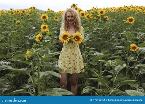 Beautiful Girl In A Huge Yellow Field Of Sunflowers Stock Photo Image