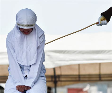 woman weeps as she is whipped 100 times for having sex before marriage under sharia law news