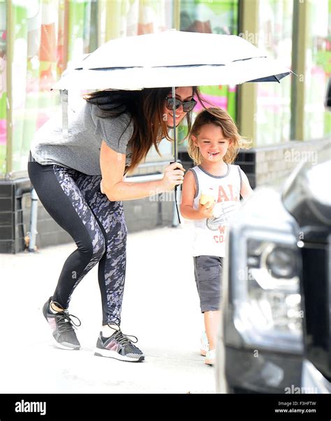 Megan Fox Picks Up Son Noah Shannon Green From Playschool And Shields Him With An Umbrella As He