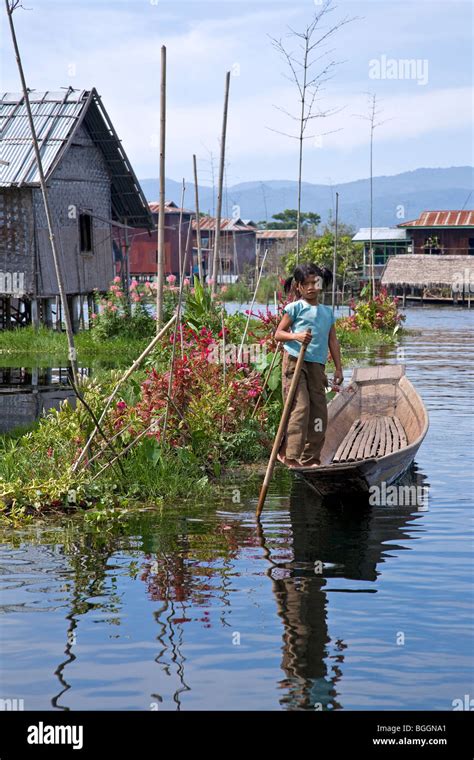 Girl Paddling A Canoe Indein Village Inle Lake Myanmar Stock Photo