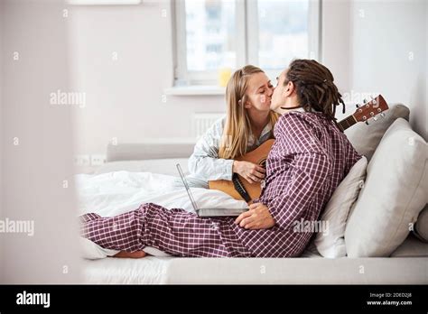 Beautiful Loving Couple Kissing In Bedroom At Home Stock Photo Alamy