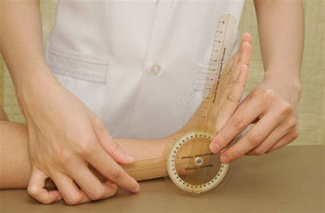 Physiotherapist Exam Patients Wrist With Goniometer Stock Image Image