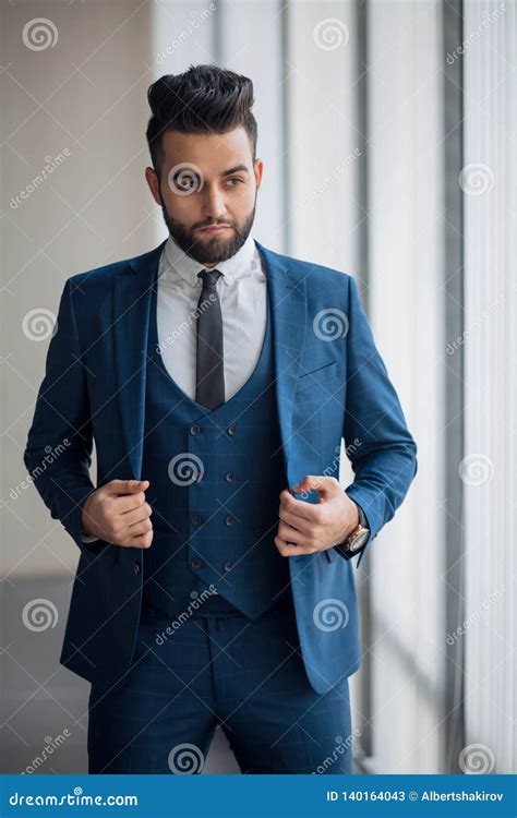 Pensive Thoughtful Attractive Ceo Is Touching His Suit Stock Image