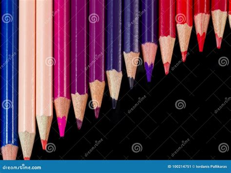 Color Pencils In Diagonal Formation Isolated On Black Warm Palette