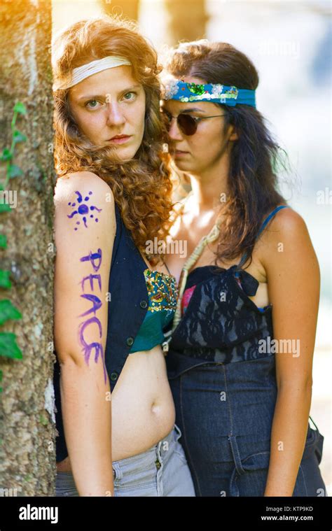 Cute Free Hippie Girls Outdoor In Peace And Free Love Top View Vintage Effect Photo Stock