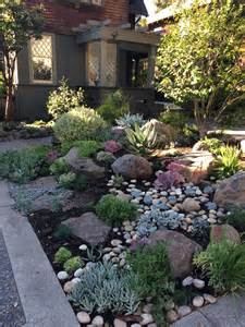 We all spend so much time trying to keep our lawns looking neat and tidy, why not add a stylish twist to your garden borders too? Like the use of rocks and succulents | Front yard ...