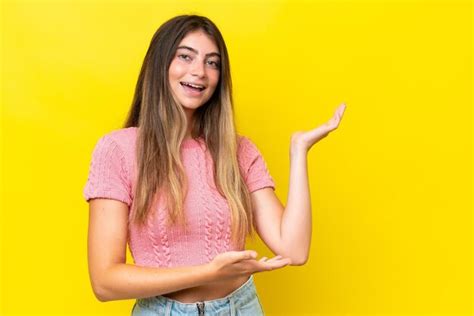 Premium Photo Young Caucasian Woman Isolated On Yellow Background