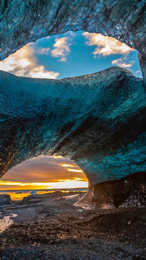 Download Wallpaper 540x960 Base Cave Arch Coast Sunset Samsung