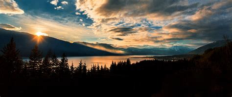 Download Wallpaper 2560x1080 Mountains Lake Sunset Horizon Clouds