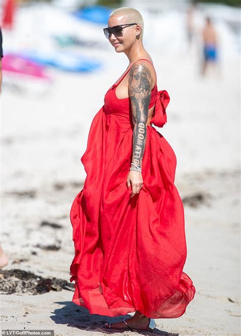 Amber Rose Flaunts Cleavage In Flowing Red Maxi Dress After Getting