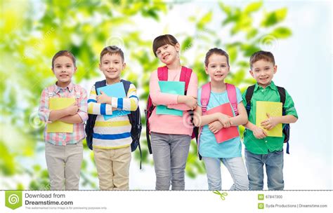 Happy Children With School Bags And Notebooks Stock Photo