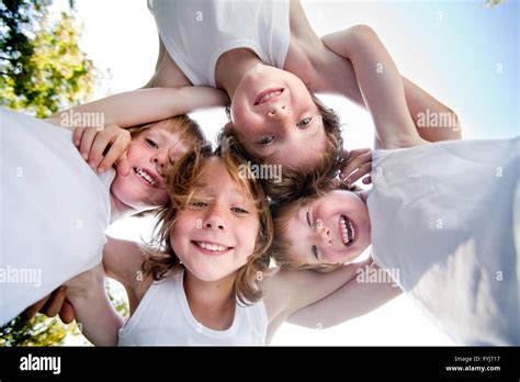 Happy Children In White Shirts In The Sky Stock Photo Alamy