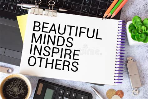 Hand With Marker Writing The Word Beautiful Minds Inspire Others Stock