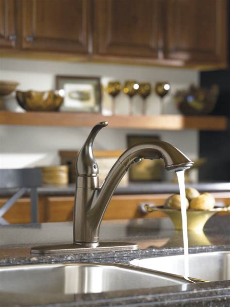 All the info i've found for such faucets shows a removable cap on top of the handle; Moen 7545ORB Camerist Single-Handle Pullout Kitchen Faucet ...