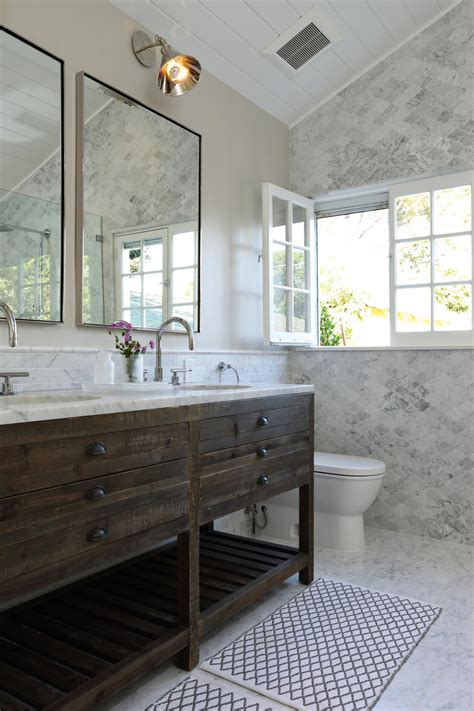 A contemporary rustic bathroom with a wooden wall and. Rustic Vanity in Marble Bathroom | HGTV