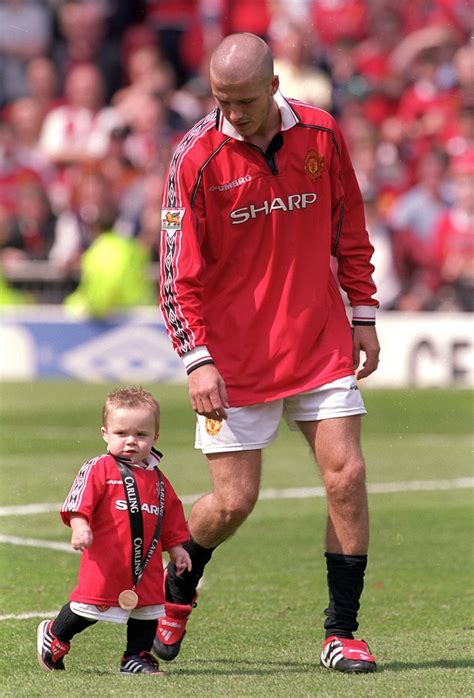 This is what david beckham looked like before he was covered in tattoos. In May 2000, David Beckham gave young Brooklyn his medal ...
