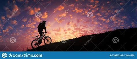 cyclist riding uphill against majestic colorful sunset stock image image of helmet biking