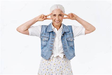 Cheerful Happy Smiling Modern Old Woman Granny Showing Peace Or
