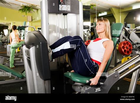 Photo Of Sporty Woman In Gym Sitting On Special Training Apparatus And