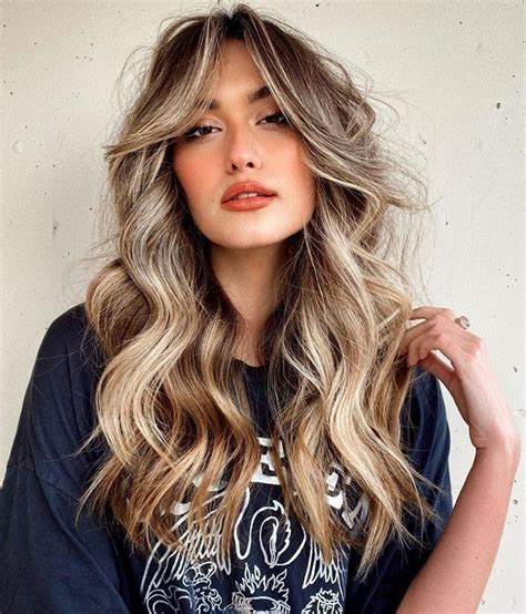 23 Chic Curtain Bangs For Wavy Hair That Are Trending Right Now 2023