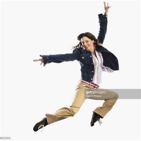 Woman Leaping In Air High Res Stock Photo Getty Images