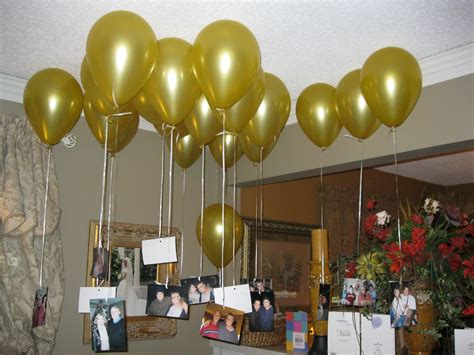 Some Balloons Are Hanging From The Ceiling With Pictures And Photos