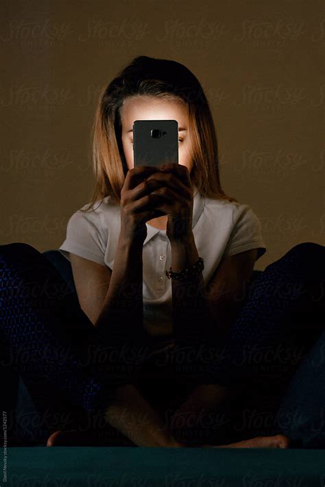 Woman Holding Phone In Front Of Face By Stocksy Contributor Danil Nevsky Stocksy