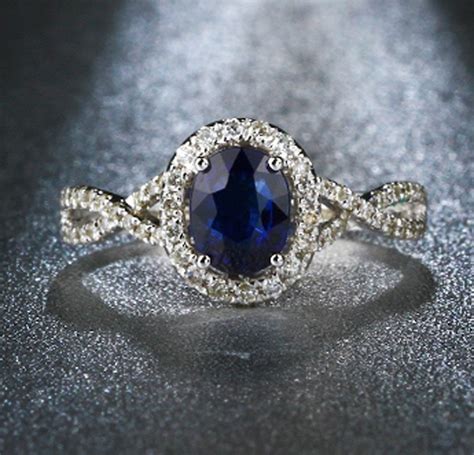 Recently purchased two carat diamond rings. 2 Carat oval cut Blue Sapphire and Diamond Halo Engagement Ring in White Gold - JeenJewels