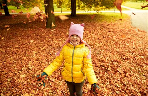 Happy Girl Playing With Autumn Leaves In Park Stock Image Image Of