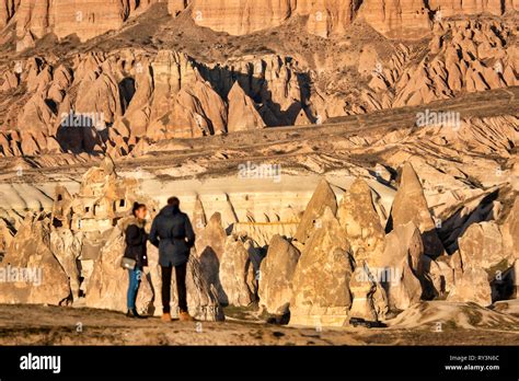 Tourists Looking At Mount Aktepe Near Göreme And The Rock Sites Of