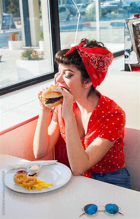 Babe Pin Up Woman In Retro Outfit Eating Burger At Diner By Audrey