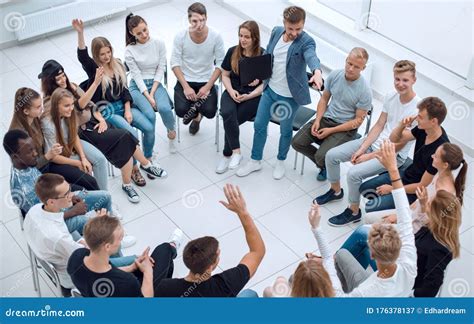 Participants Ask Questions During The Business Seminar Stock Image