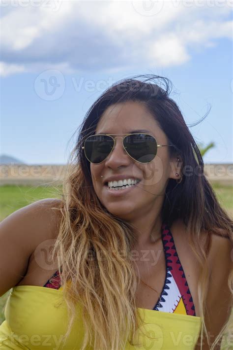 Beautiful And Happy Latin Woman With Long Hair Smiling Having A Good Time On Vacation In