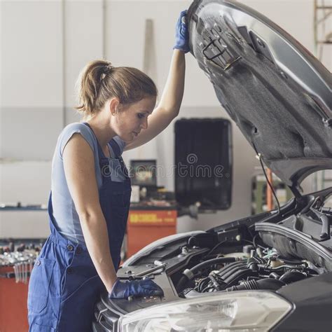 Female Mechanic Checking A Car Engine Stock Photo Image Of Automotive
