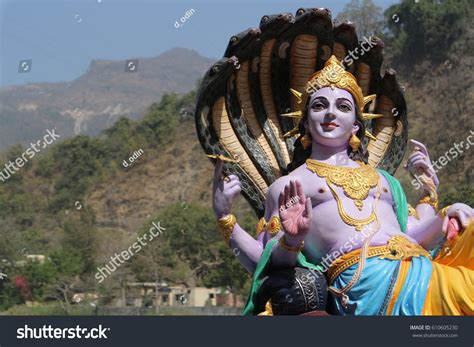 The Four Armed Lord Vishnu In The Background Of Royalty Free Stock