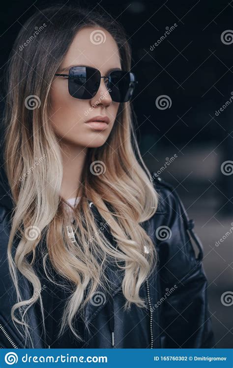 Portrait Of Beautiful Blonde Woman In Black Sunglasses In Outdoor Stock