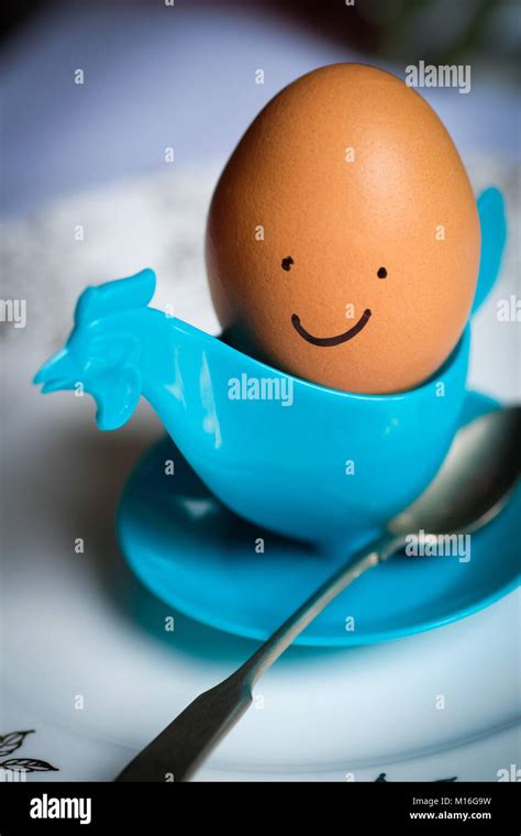 Smiley Face Egg In Chicken Egg Cup Happy Easter Stock Photo Alamy