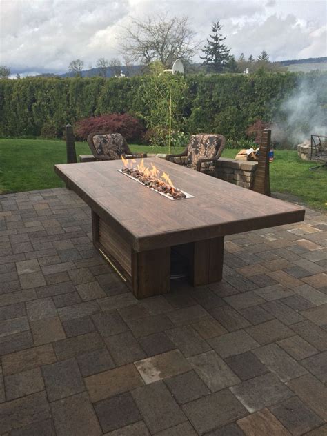 Outdoor Dining Table This Is 8x4 And Has A 4 Fire Trough The Top