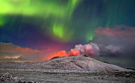 Photographer Captures Northern Lights Dancing Over Erupting Volcano In