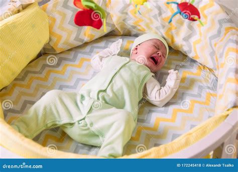 Cute Newborn Baby Crying In The Crib Stock Photo Image Of Baby