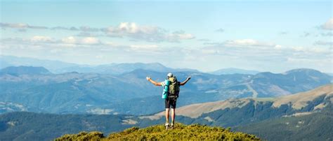 Premium Photo Hiker Standing On Top Of Mountain Unity With Nature