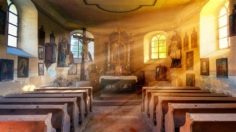 Interior of old catholic church with bright rays of sun · Free Stock Photo