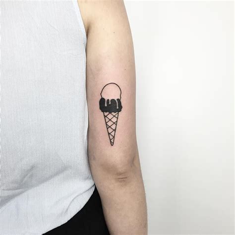 Black And White Ice Cream Cone Tattoo On The Back Of The Right Upper