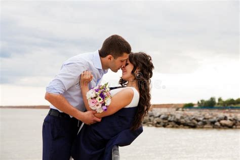 Loving Bride And Groom Kissing On The Pier Stock Photo Image Of Husband Bonding