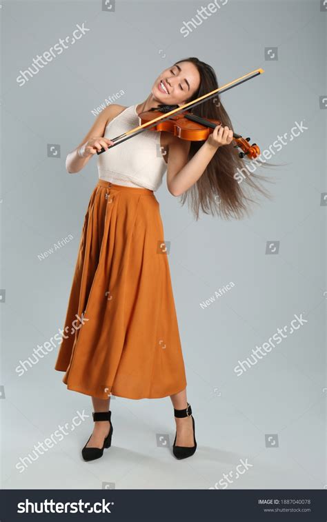 Beautiful Woman Playing Violin Over Royalty Free Licensable Stock Photos Shutterstock