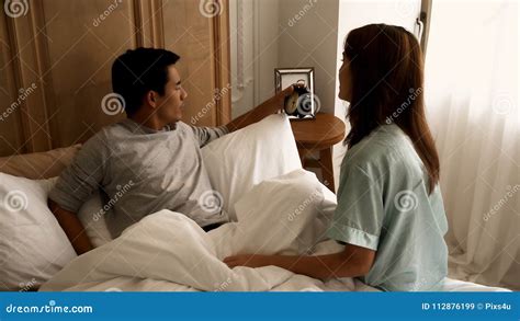 Young Wife Woke Her Husband To Wake Up When Late Royalty Free Stock