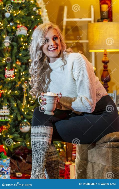 A Lovely Young Blonde Model Enjoys The Holiday Season At Home With A